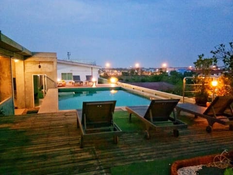 Outdoor pool, a rooftop pool, open 6:00 AM to 9:00 PM, sun loungers