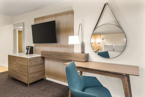 Desk, laptop workspace, blackout drapes, iron/ironing board