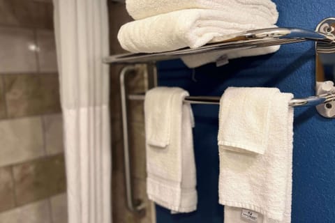 Desk, laptop workspace, iron/ironing board, cribs/infant beds