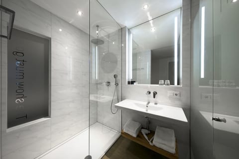 Shower, rainfall showerhead, designer toiletries, hair dryer