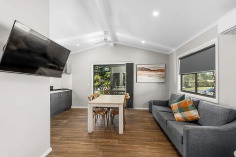 Deluxe 2 Bedroom Cabin | Living area | 32-inch flat-screen TV with cable channels