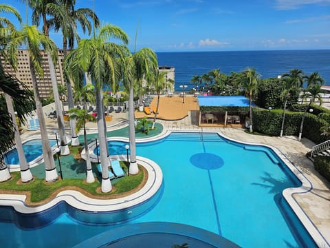 Outdoor pool, open 7:00 AM to 7:00 PM, pool umbrellas, sun loungers
