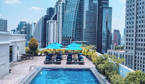 Outdoor pool, open 6:00 AM to 8:00 PM, pool umbrellas