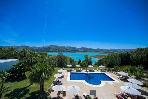 Outdoor pool, open 9:00 AM to 9:00 PM, pool umbrellas, sun loungers