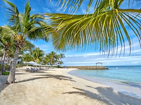 Private beach, white sand, sun loungers, beach umbrellas