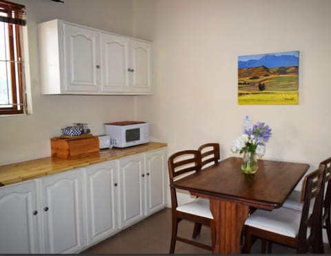 Paul Kruger Cottages | Private kitchenette | Mini-fridge, microwave, electric kettle, cookware/dishes/utensils