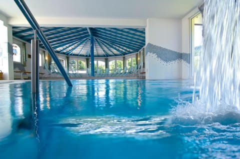 Indoor pool, seasonal outdoor pool, pool umbrellas, sun loungers