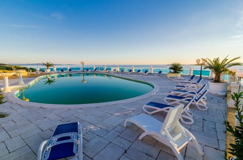 Suite (Two Bedroom Suite with Balcony and Ga) | Pool | Outdoor pool, pool umbrellas, sun loungers