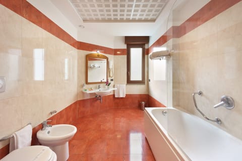 Combined shower/tub, free toiletries, hair dryer, bathrobes