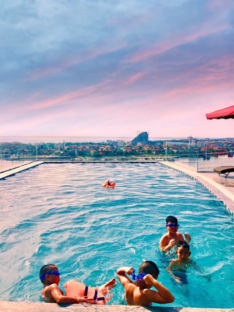 Outdoor pool, an infinity pool, sun loungers