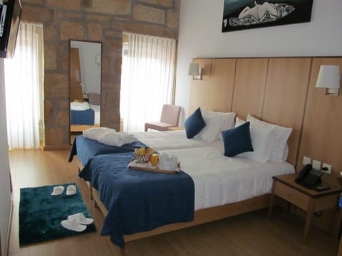 Double or Twin Room | Minibar, in-room safe, individually decorated, desk