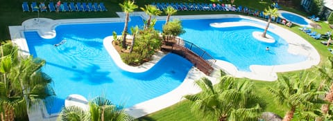 Outdoor pool, pool umbrellas, sun loungers