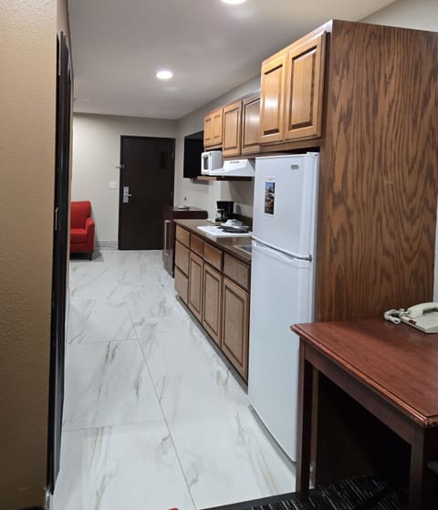 Queen Suite with Sofa Bed | Private kitchen | Fridge, microwave, stovetop, coffee/tea maker