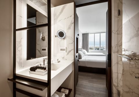 Deluxe Room, 2 Queen Beds | Bathroom | Rainfall showerhead, designer toiletries, hair dryer, bathrobes