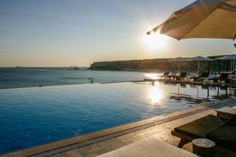 Outdoor pool, open 9:00 AM to 8:00 PM, pool umbrellas, sun loungers
