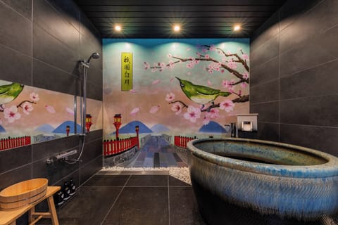 Exclusive Townhome | Bathroom | Combined shower/tub, hair dryer, slippers, electronic bidet