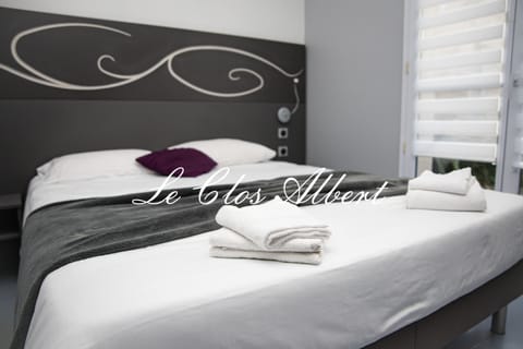 Premium bedding, desk, laptop workspace, free WiFi