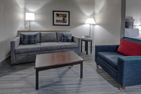 Suite, Multiple Beds | Living area | Flat-screen TV