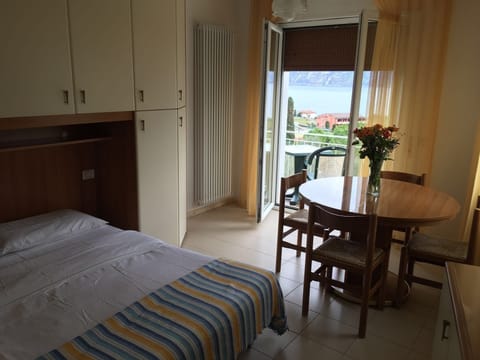Triple Room, Partial Lake View | Desk, free cribs/infant beds, free WiFi, bed sheets