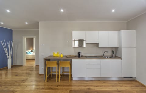 Apartment, 3 Bedrooms | Private kitchen | Fridge, microwave, stovetop, coffee/tea maker