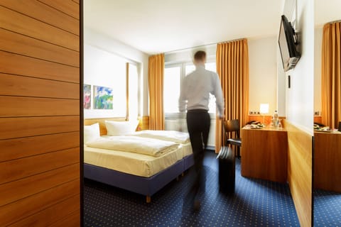 Standard Double or Twin Room | In-room safe, desk, laptop workspace, blackout drapes