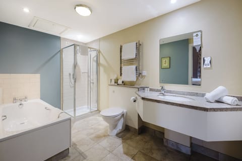 Deep soaking tub, designer toiletries, hair dryer, towels