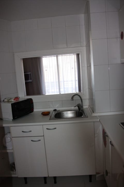 Full-size fridge, microwave, stovetop, electric kettle