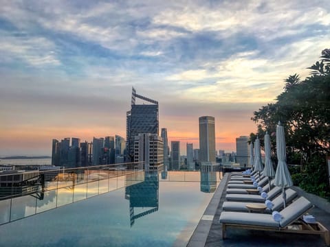 Outdoor pool, open 8:00 AM to 10:00 PM, pool umbrellas, sun loungers