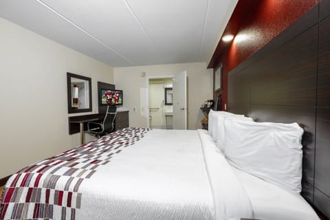 Desk, laptop workspace, blackout drapes, iron/ironing board