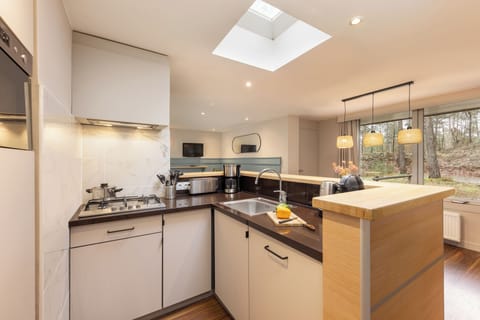 Cottage, Patio | Private kitchenette | Fridge, microwave, stovetop, dishwasher