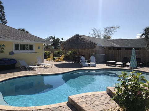 Backyard tropical paradise with heated pool and waterfall