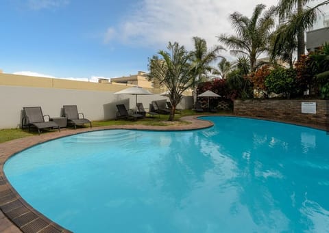 Outdoor pool, pool umbrellas, sun loungers