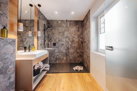 Deluxe Studio, 1 Bedroom, Garden Area | Bathroom | Shower, free toiletries, hair dryer, towels