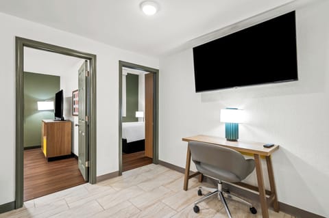 Suite, 2 Bedrooms | Desk, blackout drapes, iron/ironing board, free cribs/infant beds