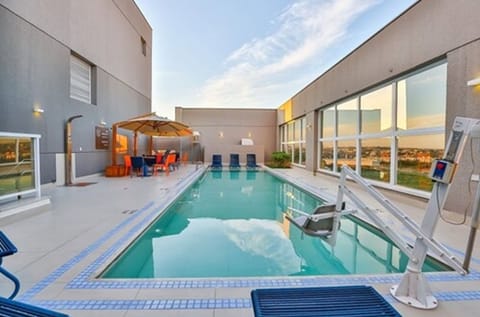 Outdoor pool, open 6:00 AM to 10:00 PM, pool umbrellas, sun loungers