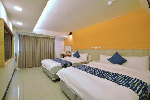 Standard Quadruple Room, City View | Desk, blackout drapes, iron/ironing board, free WiFi