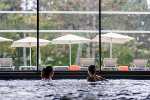 Seasonal outdoor pool, open 10:00 AM to 8:00 PM, pool umbrellas