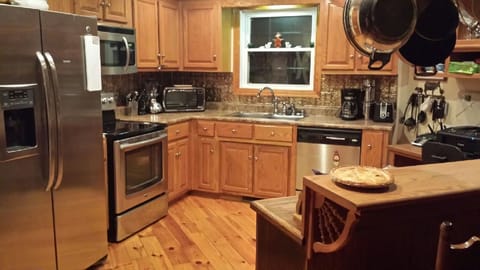 Gourmet kitchen is fully stocked with every utensil and gadget needed!