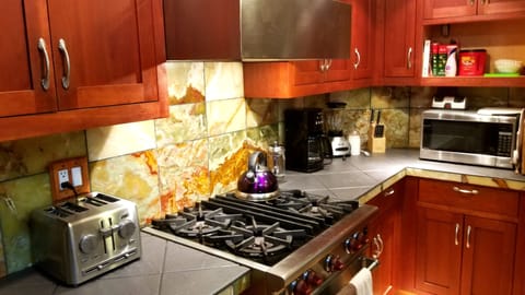 Very well stocked Cooking spices oil’s Drip Coffee maker, Keurig maker, press