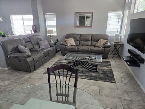 New power recling sofa and loveseat. 55" Smart TV with direct tv