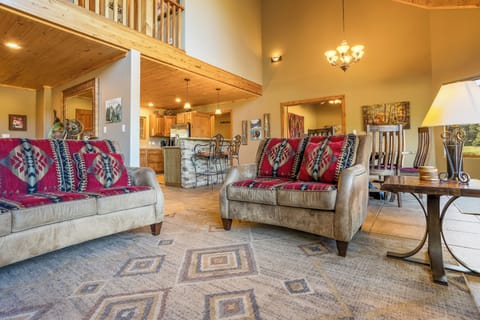 The main space features a beautiful open floor plan, uniting kitchen, living room, and breakfast nook