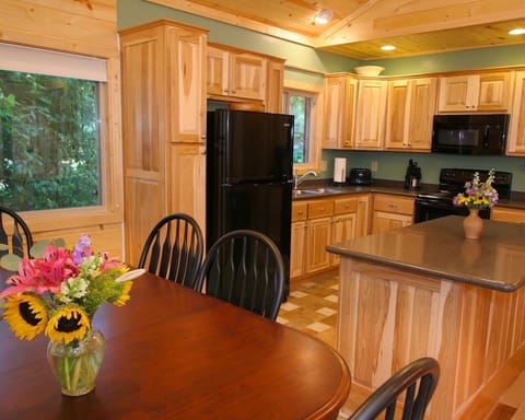 Dining and kitchen area. Coffee maker, blender, toaster, crock pot and microwave