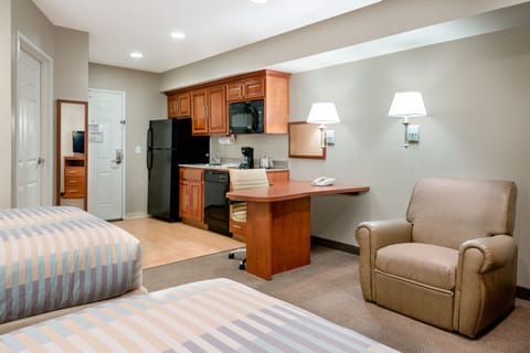 Down comforters, pillowtop beds, in-room safe, desk
