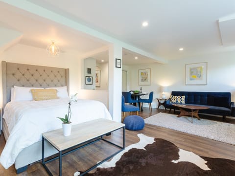 Plush queen size bed and bright and airy room.