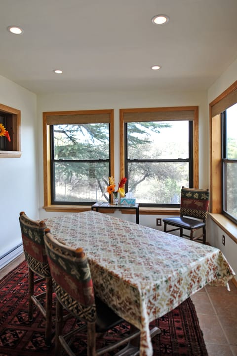 dining/sitting area with rocking chair and mountain views