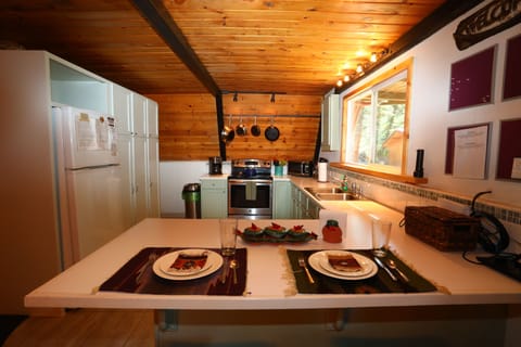 The kitchen counter has 2 stools and room for more dining. Perfect for the kids!