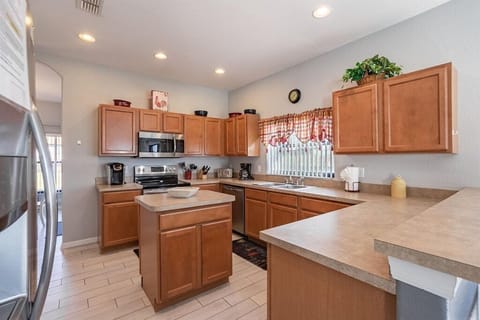 Fully equipped kitchen with modern appliances and plenty of counter space for meal prep.