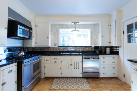 Chefs kitchen with a great view to the back patio!