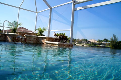 Spa and waterfall into the infinity edge pool