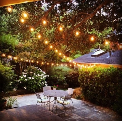 Patio outside Cottage door with hot tub and bbq